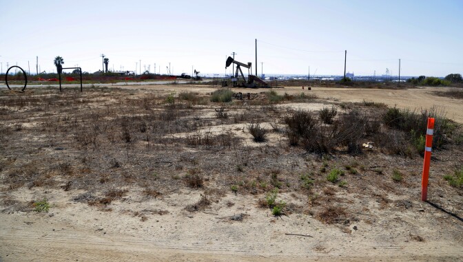 This Aug. 18, 2016 photo shows what remains of an oil-extraction operation in Banning Ranch, on what is believed to be the biggest piece of privately-owned vacant land on Southern California's coast in Newport Beach. Developers want to build 895 homes and a 75-room resort hotel on the 401-acre swath of land in upscale Newport Beach. Proponents say they would rehabilitate and preserve much of the scenic site, but opponents say the land should be left as open space. Native American groups have also begun to look into whether the site might be sacred ground.