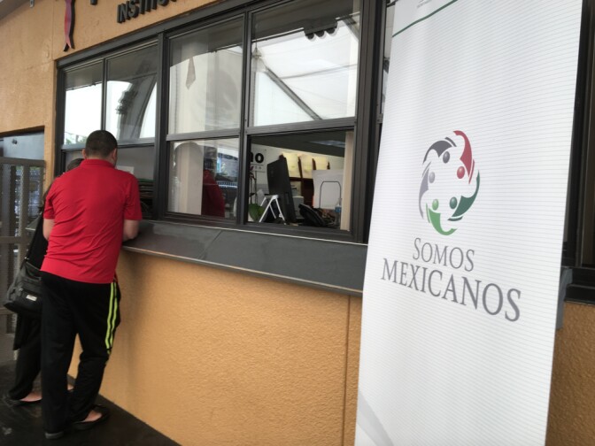 A man goes up to an information window at the Mexican consulate in Los Angeles, March 2017.