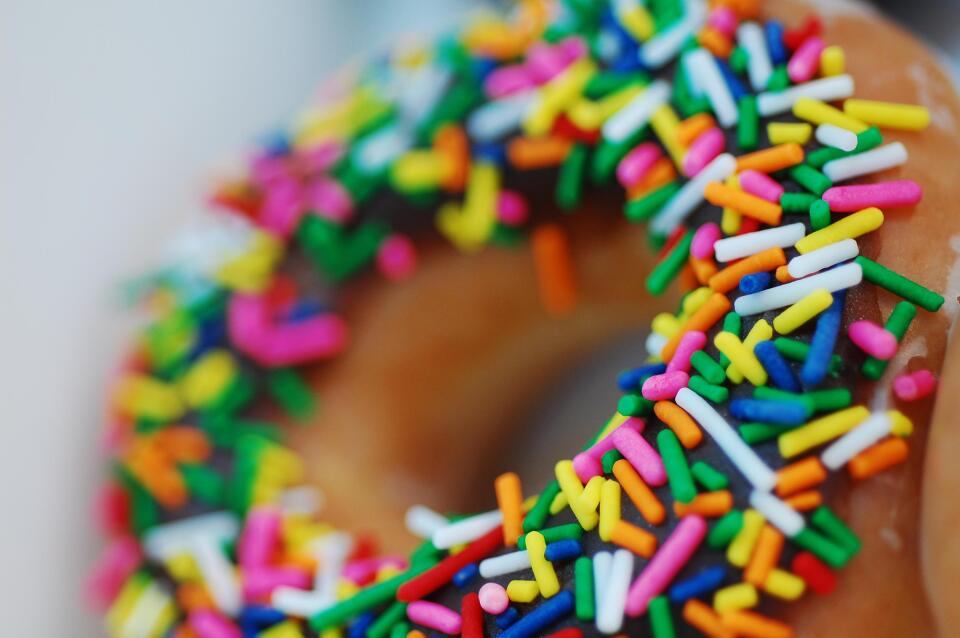 A donut with rainbow sprinkles.