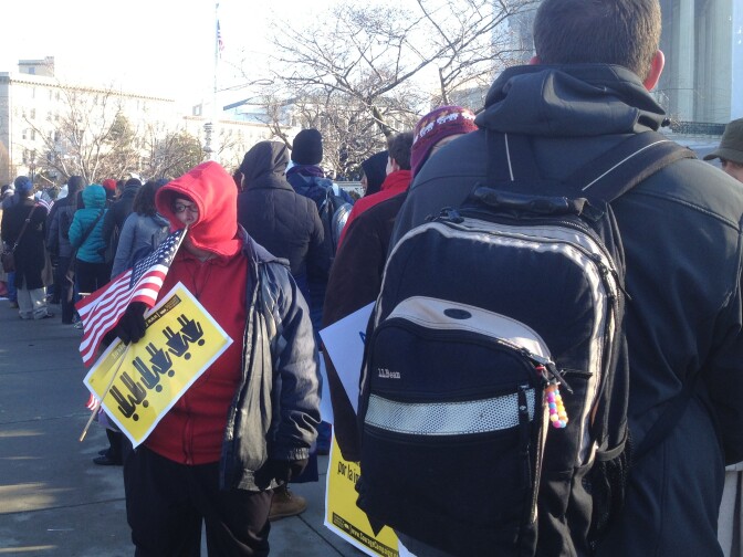 Supporters and opponents of same sex marriage wait in line in front of the U.S. Supreme Court on Tuesday, March 26 before oral arguments on the legality of California's Prop 8.