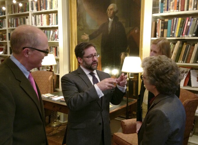 Jon Parrish Peede, center, acting head of the National Endowment for the Humanities, speaks with people from local cultural organizations during a reception, Friday, Nov. 3, 2017, in Providence, R.I. President Donald Trump proposed eliminating arts-related agencies, including the 52-year-old NEH, in his 2018 budget. (AP Photo/Jennifer McDermott)