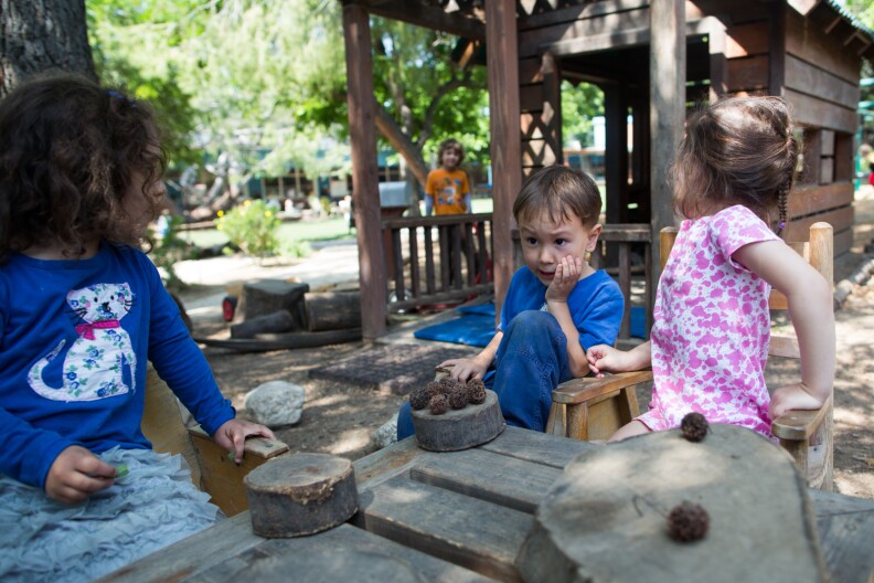 Preschool students pretend to have a tea party at the Child Educational Center in La Cañada.