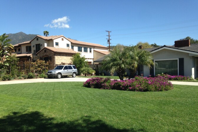 An older, traditional Arcadia home sits next to a recently-built mansion. Some of the San Gabriel Valley city's residents are frustrated by the number of bigger homes replacing older, smaller ones.