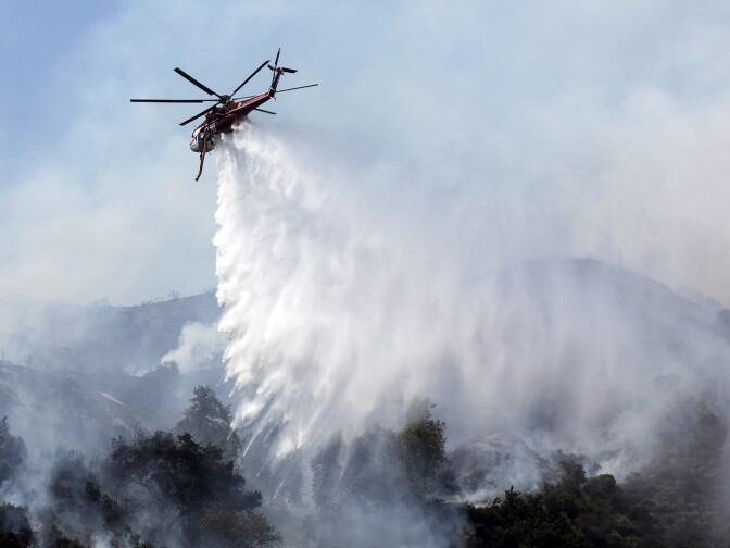 Aircraft make water drops over the San Gabriel Complex fire on Tuesday afternoon, June 21, 2016 in Bradbury near Spinks Canyon Road.