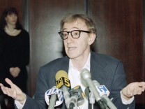 Director Woody Allen faces reporters briefly in New York, June 7, 1993, following a judge's ruling ending his attempt to gain custody of children Moses, Dylan and Satchel. The ruling followed a bitter custody battle with former lover actress Mia Farrow.