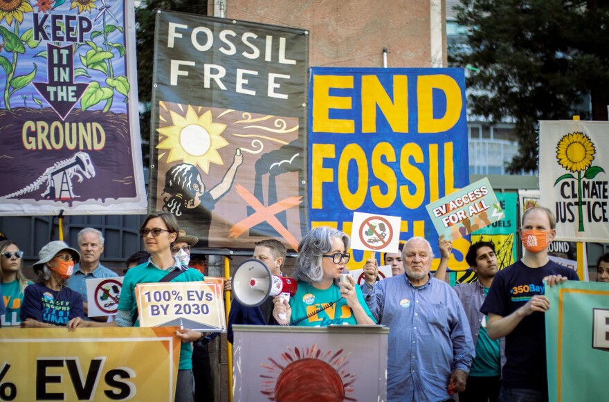 A group of environmental activists standing outside the California Air Resources Board headquarters in Sacramento.