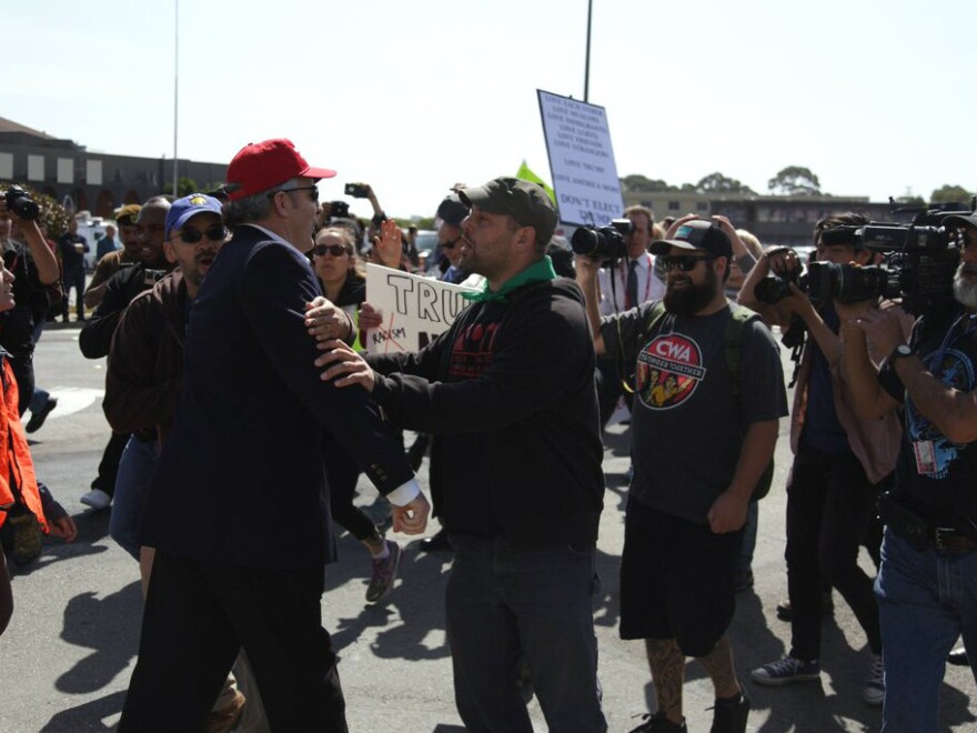 Trump supporter Christopher Conway of Burlingame gets into a skirmish with protesters on Friday, April 29, 2016.