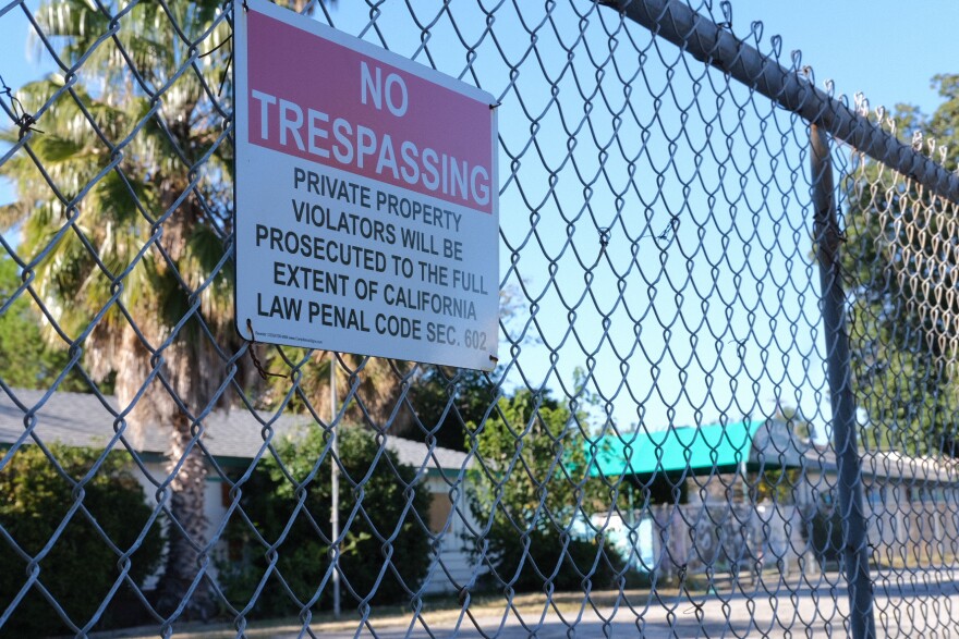 A fence surrounds a defunct private school in Winnetka where a developer hoped the city would fast-track 360 new low-income apartments.