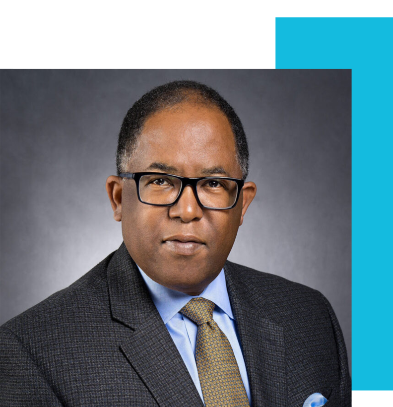 Los Angeles City Councilmember Mark Ridley-Thomas is photographed in a headshot wearing a charcoal suit, blue shirt and tie.