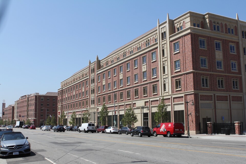 Instead of using fences, designers created a border for USC Village with buildings.
