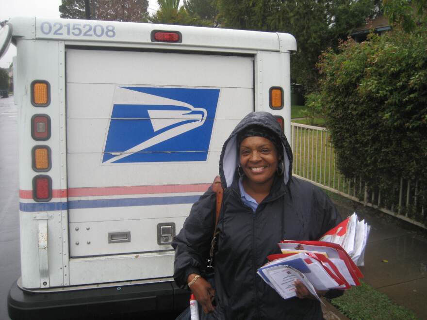 Letter carrier Cheryl Leffall is ready for the rain on her route in Venice.  