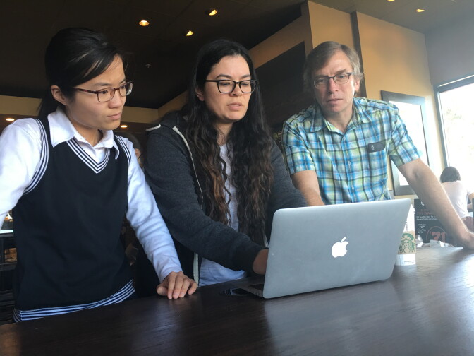 An independent, volunteer research team, led by Michael Jerrett, chair of Environmental Health Sciences at UCLA's School of Pubic Health, reviews community air samples they collected from monitors they positioned in homes  in Porter Ranch. From left to right: Peking University PhD student, Helene Wang; UC Berkeley PhD student, Diane Garcia-Gonzales;  and UCLA's Jerrett.