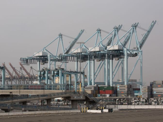 Trucks and ships remain idle at the APM Terminals at the Port of Los Angeles as a result of the clerical workers strike.