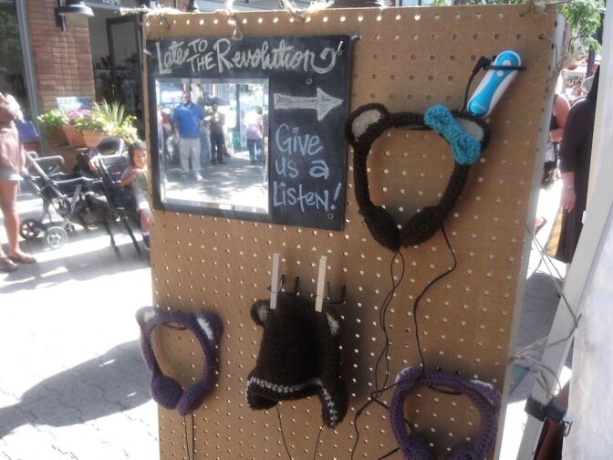 Headphones at the Late To The Revolution Booth after being crocheted.