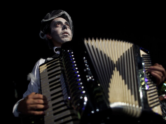 Ulises Rodriguez plays the accordion while warming for a dress rehearsal of The Long Road Today, a play about how the Santa Ana community heals together in the wake of a child's death.