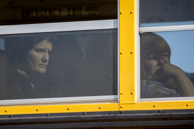 SAN BERNARDINO, CA - DECEMBER 2:  Employees and other people are evacuated by bus from the site of a mass shooting at the Inland Regional Center December 2, 2015 in San Bernardino, California. Multiple fatalities were reported as police search for up to 3 suspects who are still at large. (Photo by David McNew/Getty Images)