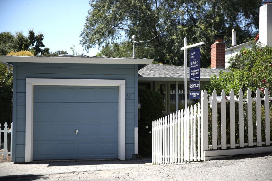 SAN ANSELMO, CA - JULY 18:  A sign is posted in front of a home for sale on July 18, 2017 in San Anselmo, California.  California is experiencing a housing crisis with a low number of afforable homes for sale. The State's median home price is around $500,000 and some areas are well over a a million dollars.  (Photo by Justin Sullivan/Getty Images)