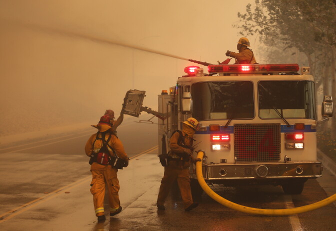 RANCHO CUCAMONGA, CA - APRIL 30: Firefighters battle the wind driven Etiwanda fire burning very close to homes on April 30. 2014 in Rancho Cucamonga, California. Flames from the fire which started in the San Bernardino National Forest spread quickly down the mountain into Ranch Cucamonga. (Photo by Jonathan Alcorn/Getty Images)