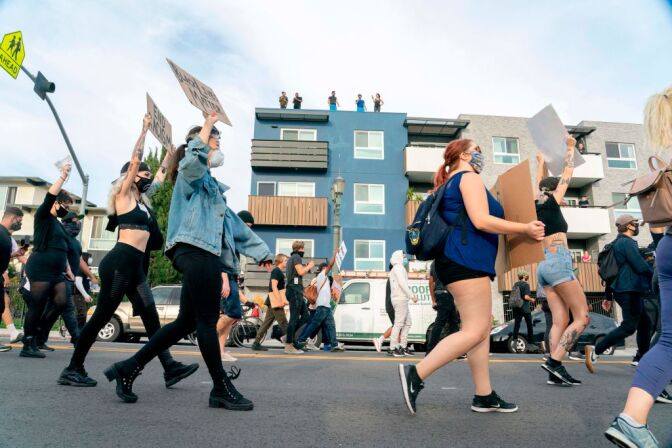 Protesters march through Hollywood after curfew during a demonstration over the death of George Floyd while in Minneapolis Police custody, in Los Angeles, California, June 2, 2020. - Anti-racism protests have put several US cities under curfew to suppress rioting, following the death of George Floyd in police custody. (Photo by Kyle Grillot / AFP) (Photo by KYLE GRILLOT/AFP via Getty Images)