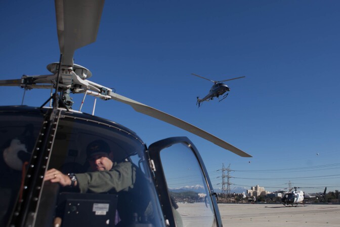 A police helicopter takes off from the Los Angeles Police Department helipad in Downtown. During the day, there is always one helicopter in the air patrolling the city skies.