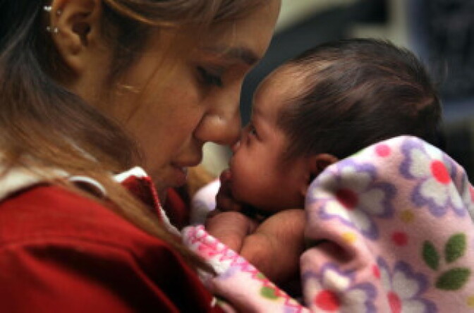 Janeth Fernandez holds her daughter Sarah during a newborn check-up on February 23, 2010 in Aurora, Colorado.