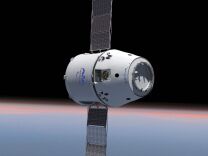 This computer generated image provided by SpaceX shows their Dragon spacecraft with solar panels deployed. The world's first private supply ship flew tantalizingly close to the International Space Station on Thursday, May 24, 2012 but did not stop, completing a critical test in advance of the actual docking scheduled for Friday, May 25, 2012. (AP Photo/SpaceX)