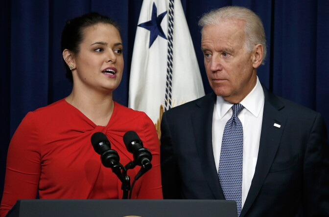 U.S Vice President Joe Biden (R) listens as Madeleine Smith, a graduate of Harvard University who was raped while attending college, speaks during an event at the Eisenhower Executive Office Building April 29, 2014 in Washington, DC.