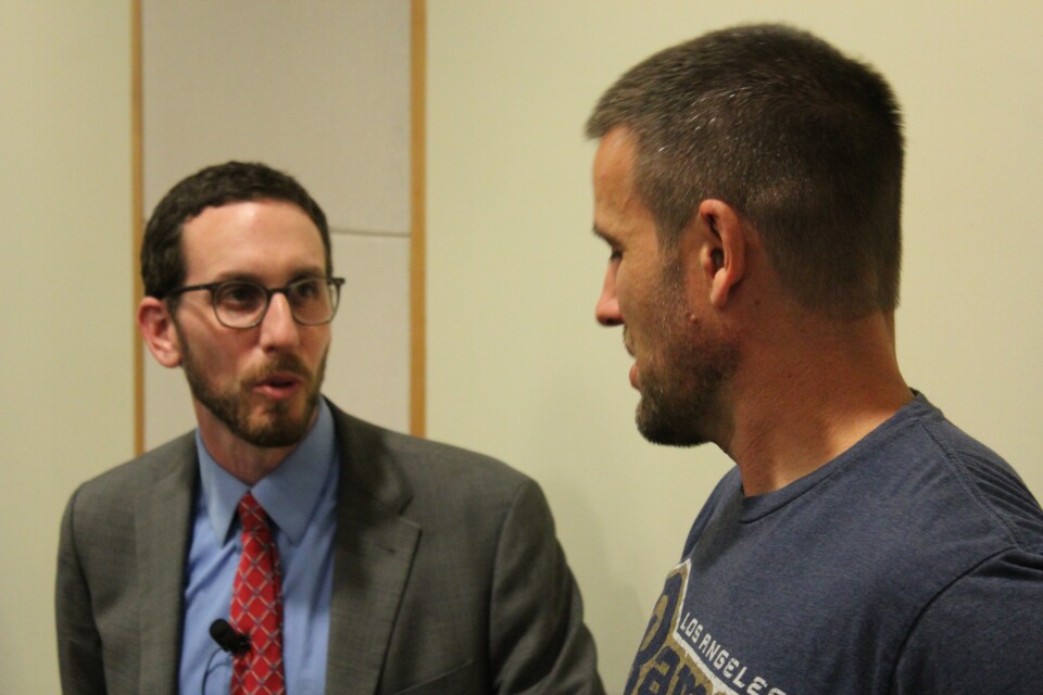 State Sen. Scott Weiner (D-San Francisco) speaks to an attendee at an Abundant Housing LA event.  