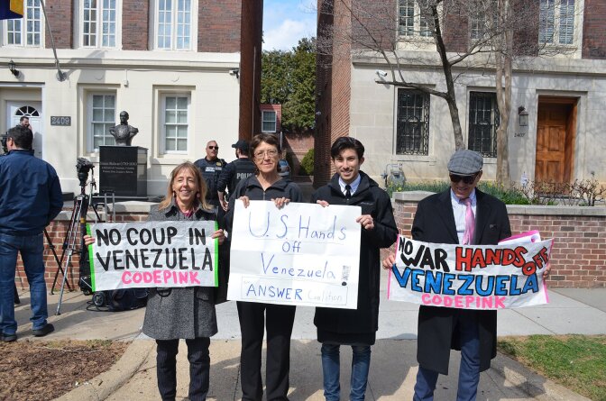 Gloria La Riva, second to the left, holds a "U.S. Hands off Venezuela!" sign in Washington D.C. on March 18, 2019.