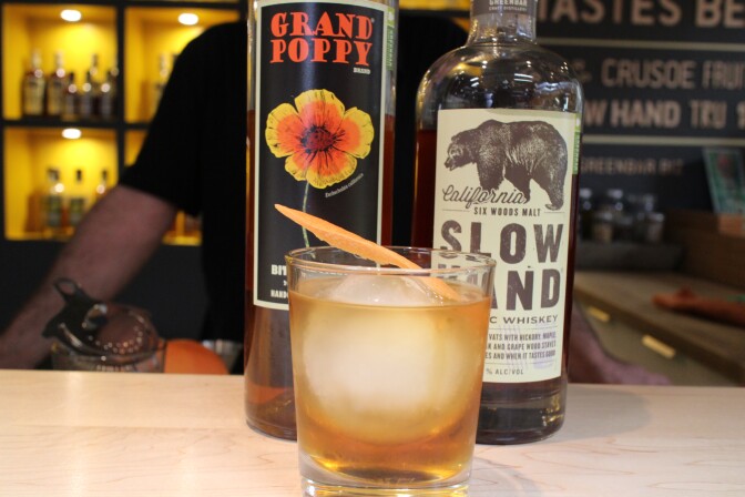"California Love" combines Grand Poppy Liqueur and Slow Hand Six-Wood Whiskey with grapefruit.