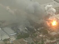 Aerial footage from KPCC's media partner NBC4 showed fire and smoke rising from what fire officials said was a recycling plant fire early Tuesday, June 14, 2016.