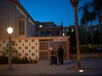 Donna Lynn and Curtis Gamble stand outside of a church dinner in Fullerton, California.There are mixed opinions on a housing project for homeless people proposed for the 1600 block of Commonwealth Avenue in Fullerton, California. (Kyle Grillot for KPCC)