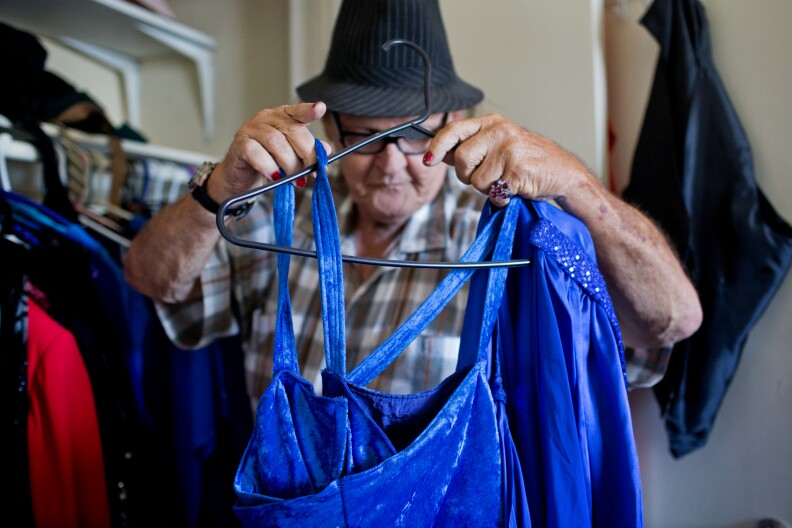 Rosie Del Mar has lived at Triangle Square for five years. She keeps her long gowns in a closet inside her one bedroom apartment. In the fall and winter, Del Mar works for game management at UCLA football and basketball games, checking tickets at the gate. 
