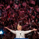 NEW YORK, NY - JUNE 7: Democratic presidential candidate Hillary Clinton arrives onstage during a primary night rally at the Duggal Greenhouse in the Brooklyn Navy Yard, June 7, 2016 in the Brooklyn borough of New York City. Clinton  has secured enough delegates and commitments from superdelegates to become the Democratic Party's presumptive presidential nominee. She will become the first woman in U.S. history to secure the presidential nomination of one of the country's two major political parties. (Photo by Drew Angerer/Getty Images)