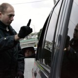 California Highway Patrol officer Mike Robinson gives a sobriety test to a man in car at a sobriety checkpoint December 26, 2004 in San Francisco, California. 