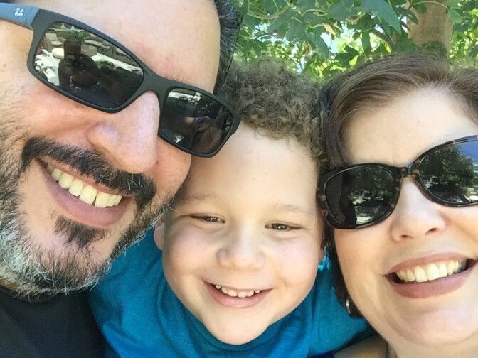 Angie Sanders with her son and husband 