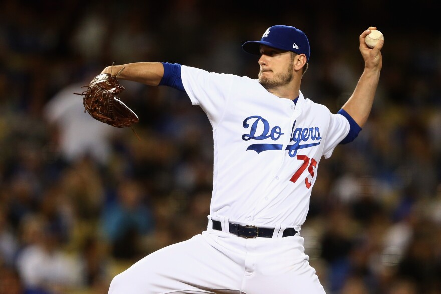 LOS ANGELES, CA - APRIL 17:  Grant Dayton #75 of the Los Angeles Dodgers pitches during the fifth inning of a game against the Arizona Diamondbacks  at Dodger Stadium on April 17, 2017 in Los Angeles, California.  (Photo by Sean M. Haffey/Getty Images)
