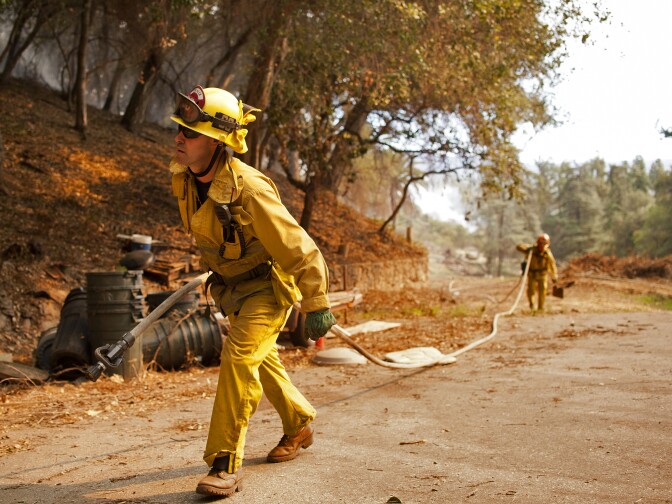 Firefighters work to fight the Colby Fire in the mountains near Glendora on Thursday. The blaze has burned 1,700 acres so far according to LA County Fire as of 10:07 a.m. on Thursday. 