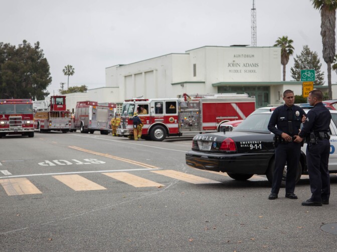 Law enforcement officials block the entrance to Santa Monica College after a shooting spree on Friday.