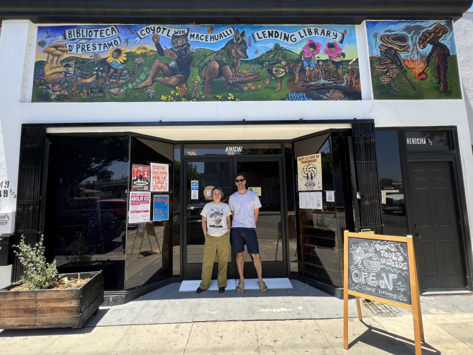 Coyotl+Macehualli  co-founders Brenda Contreras and Micah Haserjian stand outside the Tool and Book Lending Library on 3347 Eastern Avenue in El Sereno.