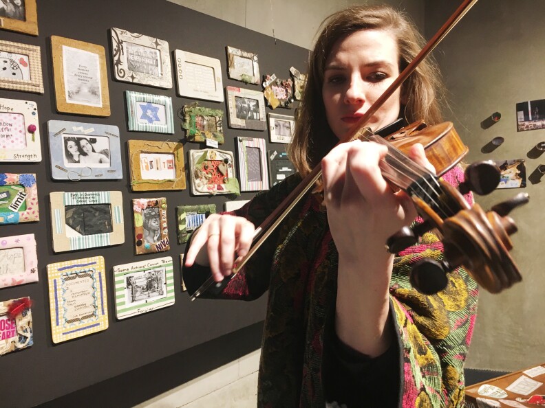 Maria Sławek plays violin at the Los Angeles Museum of the Holocaust.