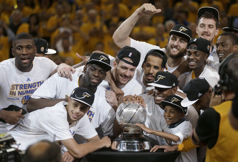 Golden State Warriors players celebrate after Game 5 of the NBA basketball Western Conference finals against the Houston Rockets in Oakland, Calif., Wednesday, May 27, 2015. The Warriors won 104-90 and advanced to the NBA Finals. (AP Photo/Ben Margot)