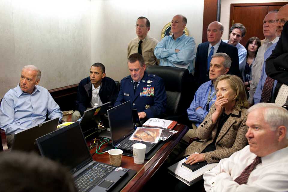 FILE - In this May 1, 2011 image released by the White House and digitally altered by the source to diffuse the paper in front of Secretary of State Hillary Rodham Clinton, President Barack Obama and Vice President Joe Biden, along with with members of the national security team, receive an update on the mission against Osama bin Laden in the Situation Room of the White House in Washington.