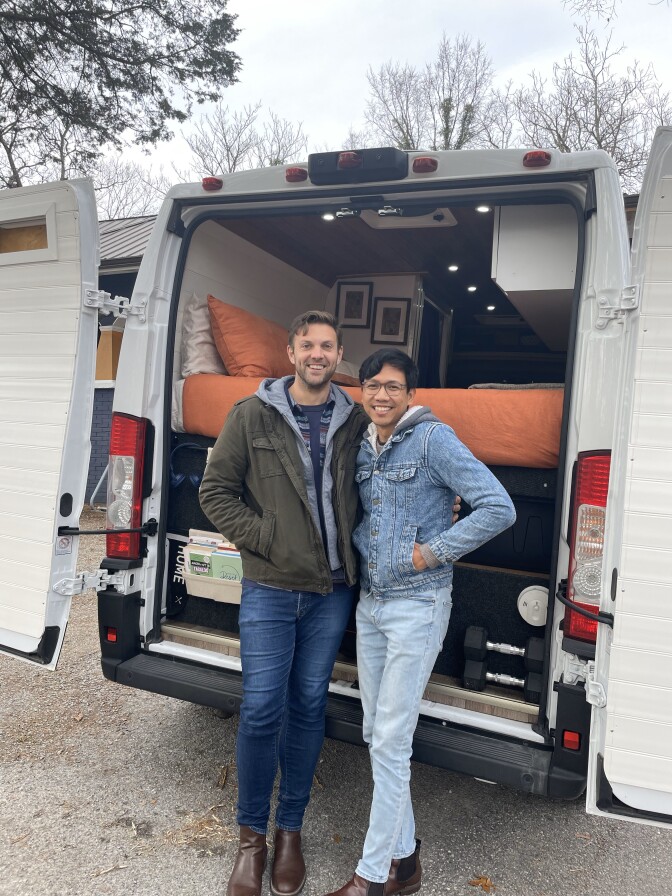 Patrick and Arthur standing outside their retro-fitted van