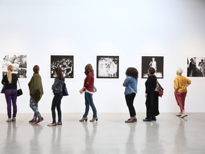 Guest view the images during the opening reception for "Brian Weil, 1979-95: Being in the World" the first career retrospective for photographer Brian Weil at the Santa Monica Museum of Art on Saturday, January 17, 2015, in Santa Monica, Calif. (Photo by Ryan Miller/Capture Imaging)