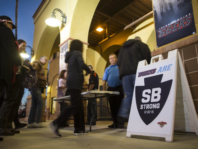 Attendees flow into a vigil at San Manuel Stadium in San Bernardino on Thursday night, Dec. 3, 2015 following a mass shooting that left 14 people dead and 21 injured on Wednesday at the Inland Regional Center.
