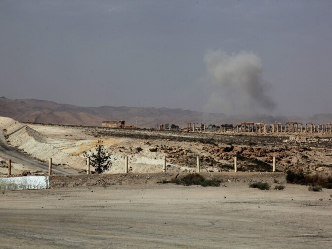 Smoke rises after a Syrian Rocket launcher shell on Islamic State positions in the ancient oasis city of Palmyra, about 215 kilometers northeast of Damascus on Tuesday. News reports say the Islamic State has taken control of the city.