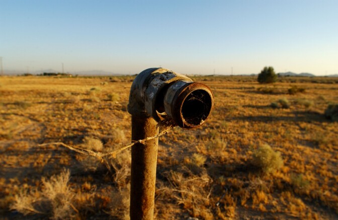 A pipe is one of the few signs that houses once stood on the property where Pacific Gas & Electric bought and razed them after the company was found to have polluted the ground water with cancer-causing hexavalent chromium for 30 years. The community's pollution struggle inspired the movie 'Erin Brockovich.' 
