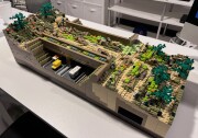 A toy set of a bridge made up of different Lego tiles in earth tone colors