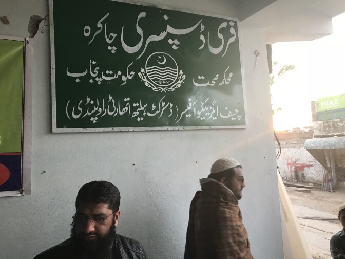 A sign indicates that this Pakistani clinic once operated by a charity is now government-run.